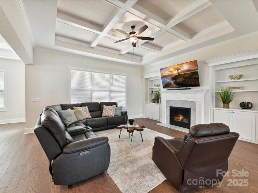 873 Penny Royal Avenue, Fort Mill, SC 29715.  MLS# CAR4234425, YatesRealty ID 16944. Family Room with Coffered Ceiling and Built-in Cabinets and Shelving