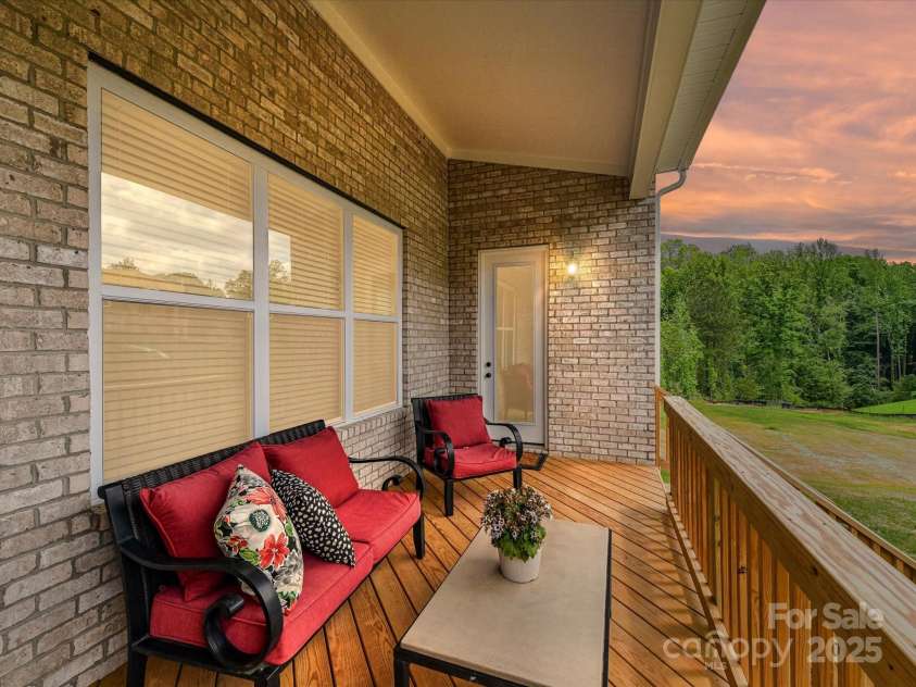 873 Penny Royal Avenue, Fort Mill, SC 29715.  MLS# CAR4234425, YatesRealty ID 16944. Twilight View of Covered Rear Deck