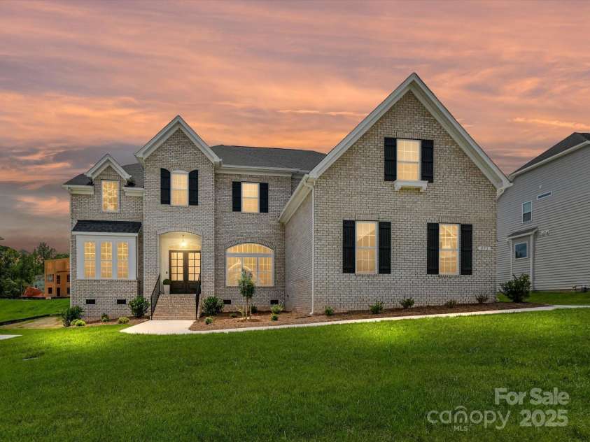 873 Penny Royal Avenue, Fort Mill, SC 29715.  MLS# CAR4234425, YatesRealty ID 16944. Twilight View of Full Brick Home