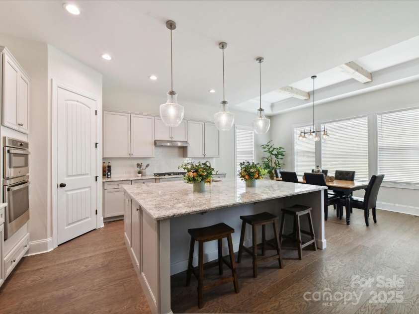 873 Penny Royal Avenue, Fort Mill, SC 29715.  MLS# CAR4234425, YatesRealty ID 16944. Wonderful Kitchen with Upgraded Light Fixtures, Carriage Doors, and Granite