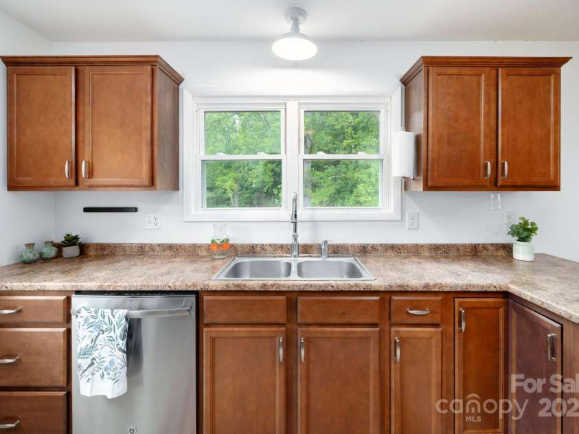 205 Cowan Cove Road, Asheville, NC 28806.  MLS# CAR4265297, YatesRealty ID 16948. A mix of drawers, a lazy susan, and large cabinets