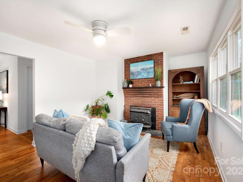 205 Cowan Cove Road, Asheville, NC 28806.  MLS# CAR4265297, YatesRealty ID 16948. Cozy living room (seller previously used this room as a dining room)