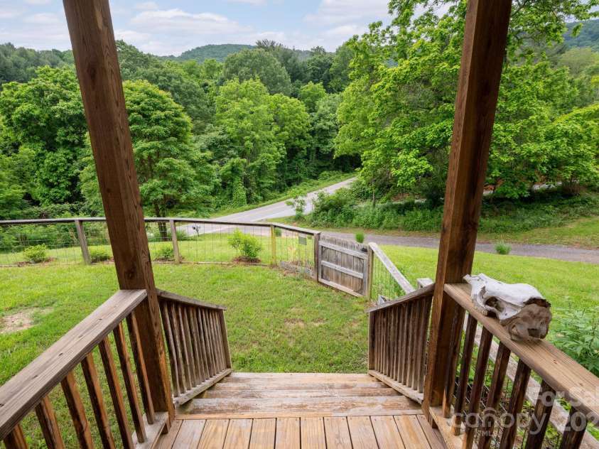 205 Cowan Cove Road, Asheville, NC 28806.  MLS# CAR4265297, YatesRealty ID 16948. Front entrance with mountain view and fenced in yard