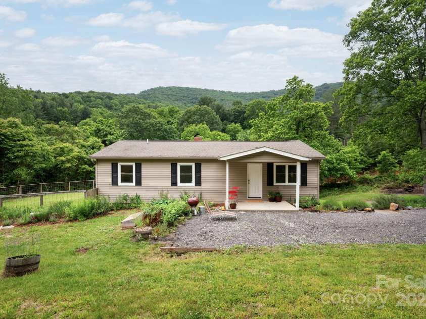 205 Cowan Cove Road, Asheville, NC 28806.  MLS# CAR4265297, YatesRealty ID 16948. Private retreat surrounded by nature