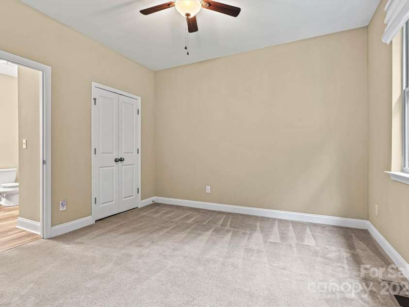 7020 Cedar Ridge Court, Mount Holly, NC 28120.  MLS# CAR4256213, YatesRealty ID 16957. 3rd bedroom is also located on the rear of the home, overlooking the backyard and woods.