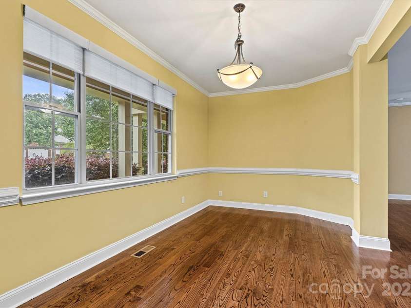 7020 Cedar Ridge Court, Mount Holly, NC 28120.  MLS# CAR4256213, YatesRealty ID 16957. Dining Room features triple windows with motorized Hunter-Douglas PowerView shades.