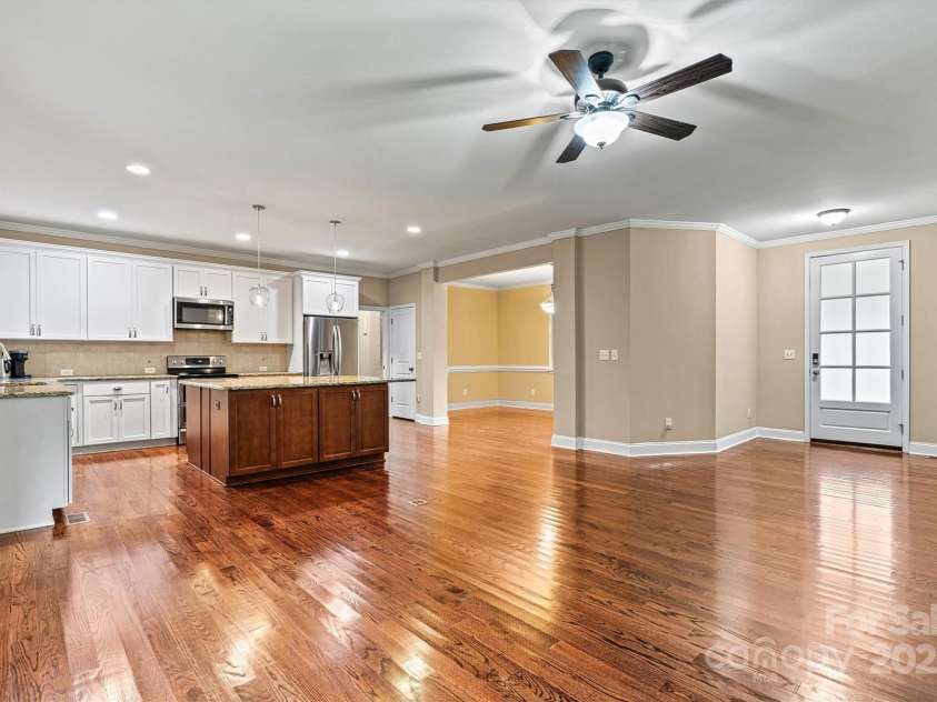 7020 Cedar Ridge Court, Mount Holly, NC 28120.  MLS# CAR4256213, YatesRealty ID 16957. Looking toward Kitchen/Dining Room/entry from Living Area.  Wide open space provides plenty of room for your family and friends to spread out.