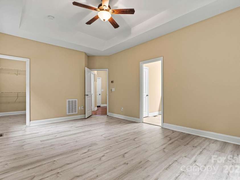 7020 Cedar Ridge Court, Mount Holly, NC 28120.  MLS# CAR4256213, YatesRealty ID 16957. Primary bedroom suite is located on the right rear corner of the home, providing complete privacy.