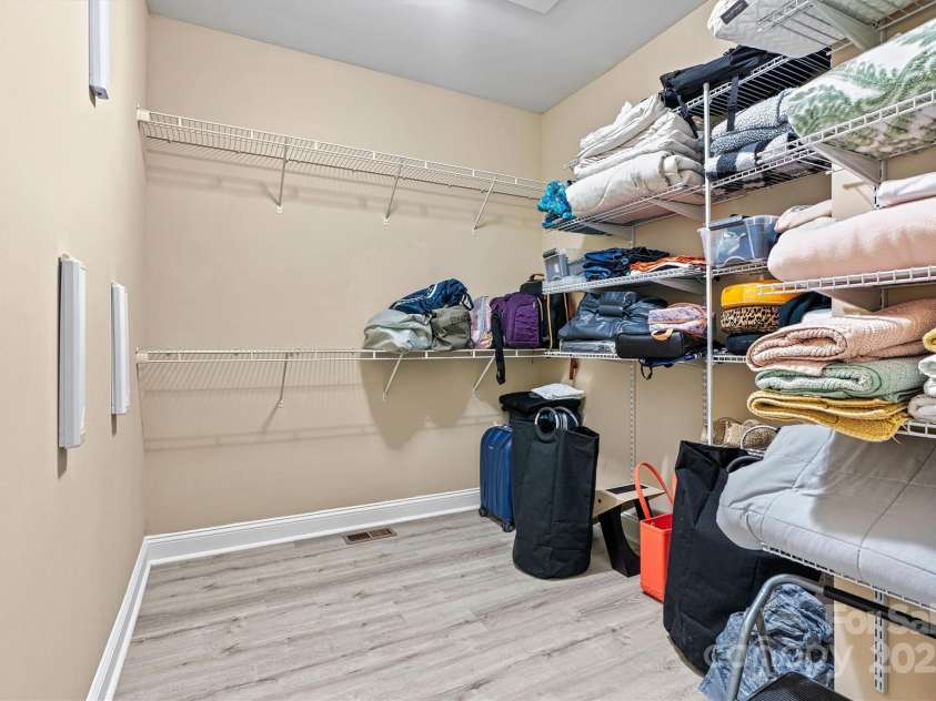 7020 Cedar Ridge Court, Mount Holly, NC 28120.  MLS# CAR4256213, YatesRealty ID 16957. Primary bedroom walk in closet.