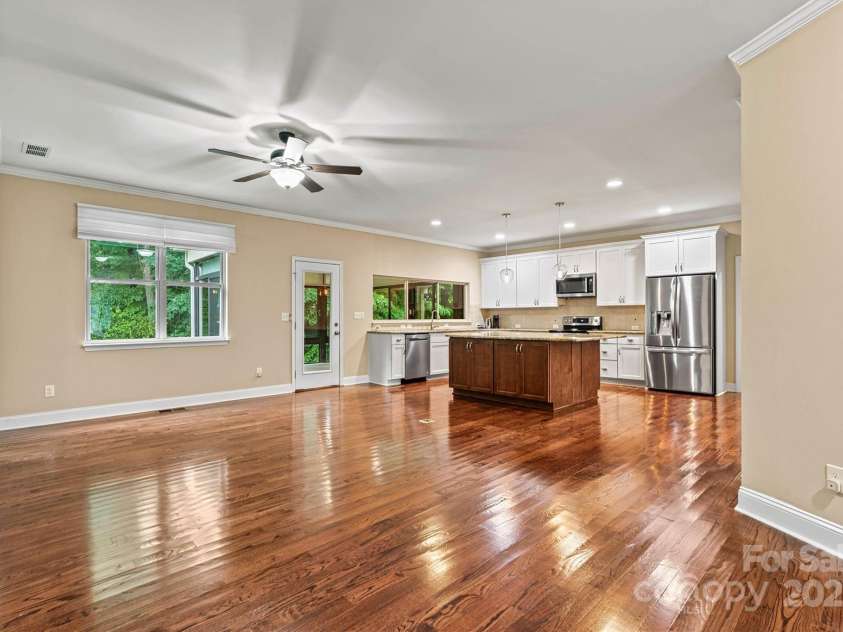 7020 Cedar Ridge Court, Mount Holly, NC 28120.  MLS# CAR4256213, YatesRealty ID 16957. View from entry, through Living Area, into Kitchen.  Such a great open concept floor plan!  The newly refinished floors are just gleaming!