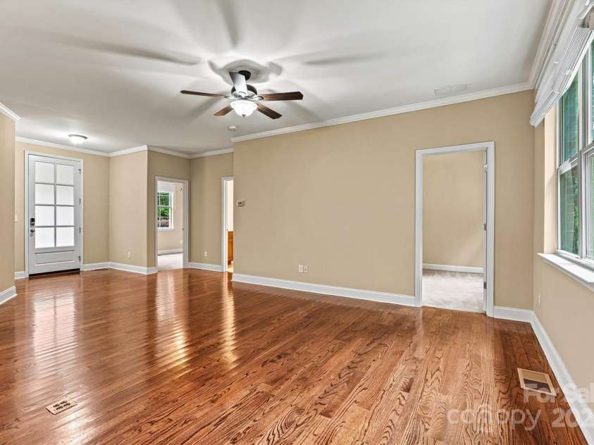 7020 Cedar Ridge Court, Mount Holly, NC 28120.  MLS# CAR4256213, YatesRealty ID 16957. View of Living Area from Kitchen.  Front door to left, then front bedroom, hall bath, and 3rd bedroom.