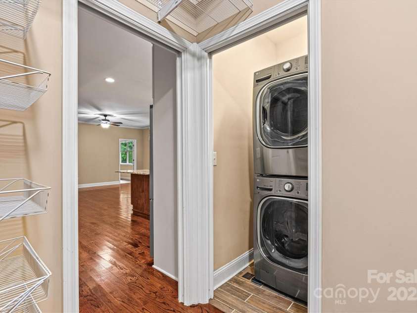 7020 Cedar Ridge Court, Mount Holly, NC 28120.  MLS# CAR4256213, YatesRealty ID 16957. Washer/dryer convey with home and are located in the mudroom off the garage, located behind the Kitchen.