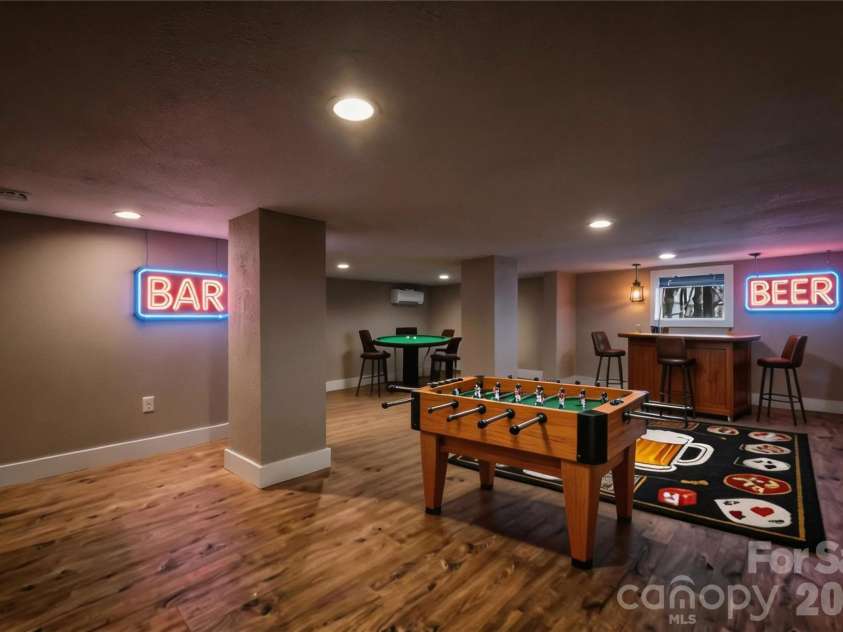 522 Brandon Road, Black Mountain, NC 28711.  MLS# CAR4353492, YatesRealty ID 16958. Finished basement bonus space with low ceiling height - shown virtually staged as a home bar / rec room