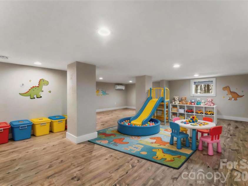 522 Brandon Road, Black Mountain, NC 28711.  MLS# CAR4353492, YatesRealty ID 16958. Finished basement bonus space with low ceiling height - shown virtually staged as a playroom
