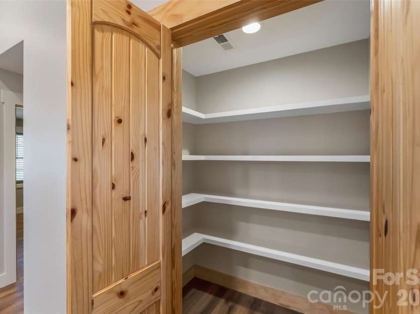 522 Brandon Road, Black Mountain, NC 28711.  MLS# CAR4353492, YatesRealty ID 16958. Walk-in pantry with custom shelving