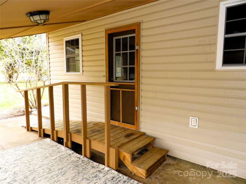 106 Pinetree Drive, Black Mountain, NC 28711.  MLS# CAR4246572, YatesRealty ID 16966. Side Entrance w/ramp