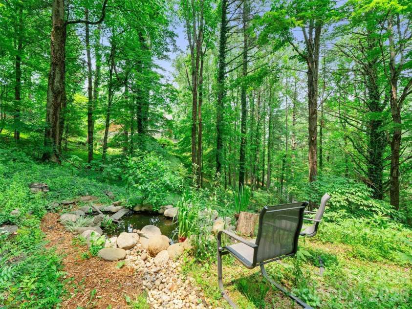 278 Mount View Drive, Burnsville, NC 28714.  MLS# CAR4259285, YatesRealty ID 16967. Dry creek bed leading to fish pond