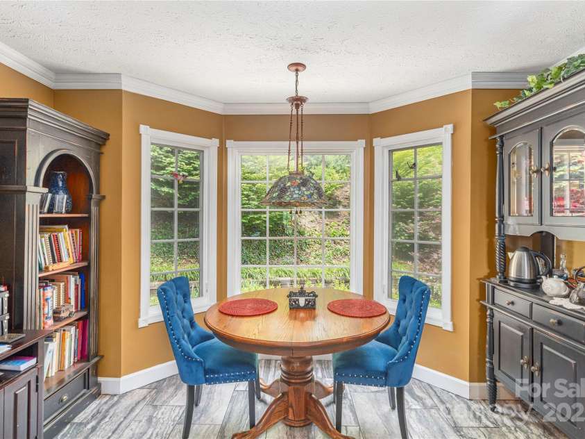 1706 Rock House Cove Road, Clyde, NC 28721.  MLS# CAR4263757, YatesRealty ID 16969. Cozy breakfast nook