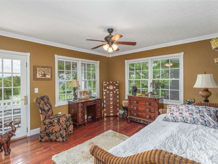1706 Rock House Cove Road, Clyde, NC 28721.  MLS# CAR4263757, YatesRealty ID 16969. Guest room with entry to the deck