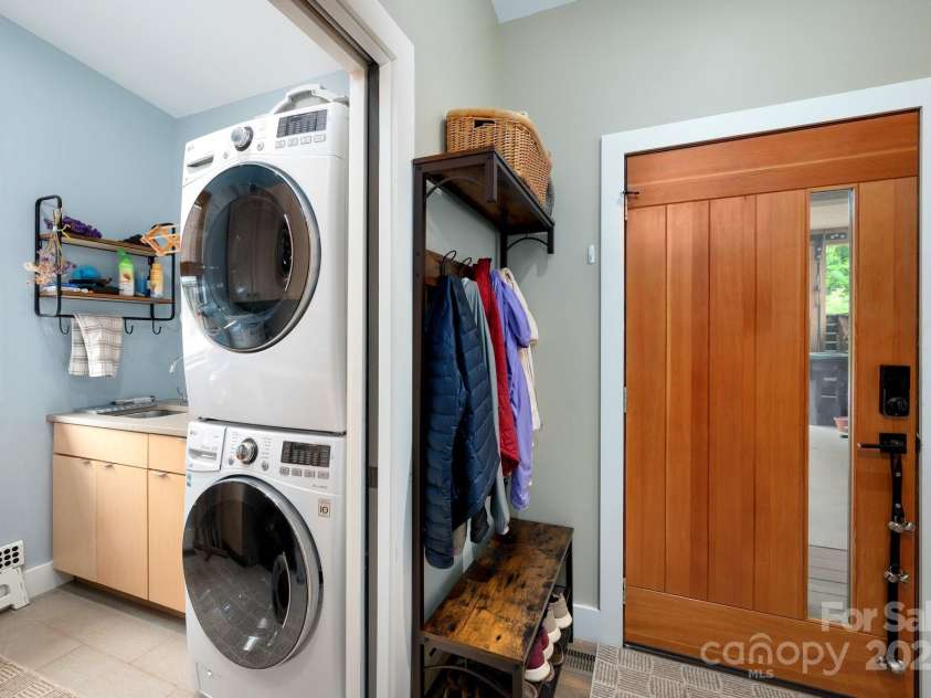 34 River Run, Asheville, NC 28804.  MLS# CAR4260631, YatesRealty ID 16973. Both a walk in pantry, and a laundry storage area adjacent