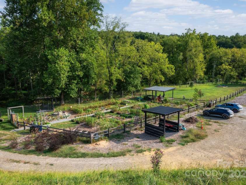 34 River Run, Asheville, NC 28804.  MLS# CAR4260631, YatesRealty ID 16973. Community gardens and dog park