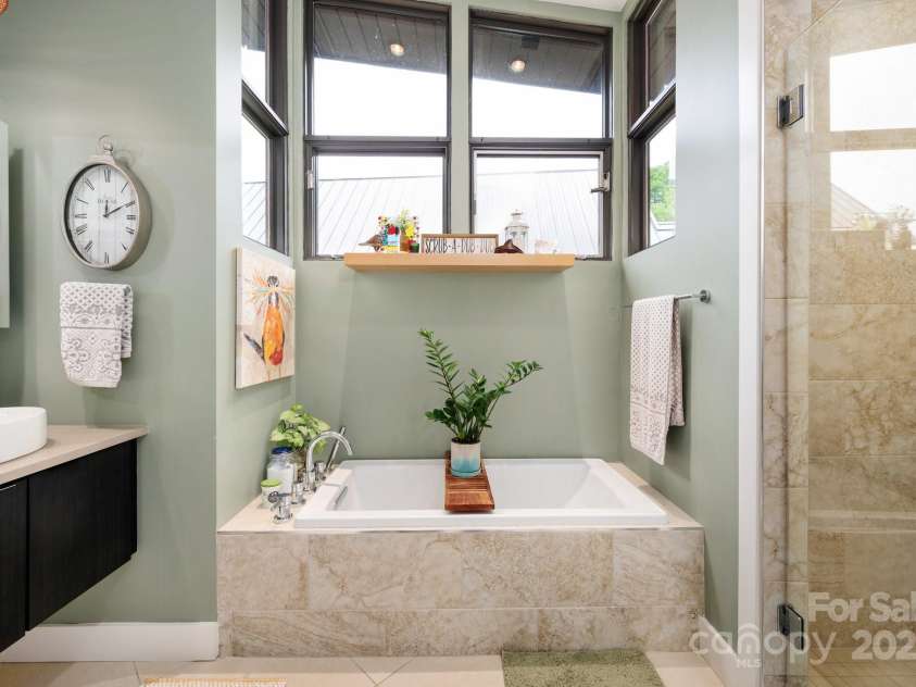 34 River Run, Asheville, NC 28804.  MLS# CAR4260631, YatesRealty ID 16973. Soaking tub and walk-in shower
