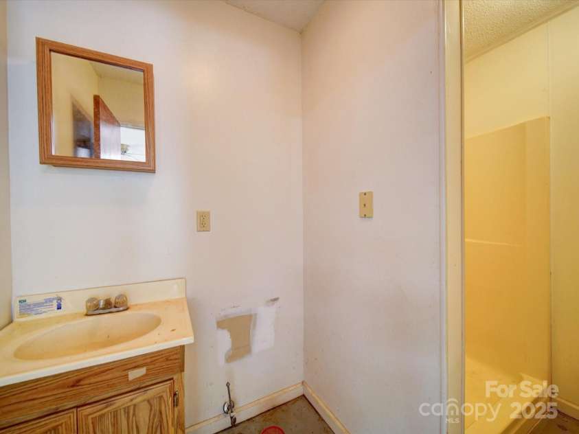 4901 Pine Oaks Drive, Monroe, NC 28112.  MLS# CAR4254474, YatesRealty ID 16975. Workshop bathroom