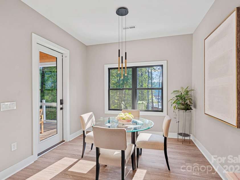 127 Holt Lane, Mooresville, NC 28117.  MLS# CAR4248273, YatesRealty ID 16978. Breakfast Nook with Lake Views, Access to Covered Deck