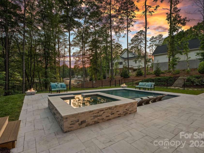 127 Holt Lane, Mooresville, NC 28117.  MLS# CAR4248273, YatesRealty ID 16978. Pool at Twilight