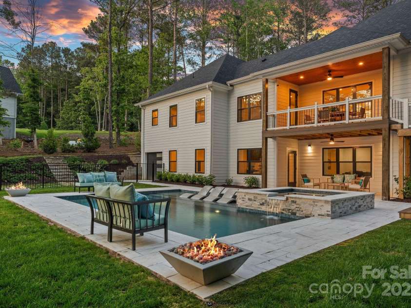 127 Holt Lane, Mooresville, NC 28117.  MLS# CAR4248273, YatesRealty ID 16978. Pool at Twilight