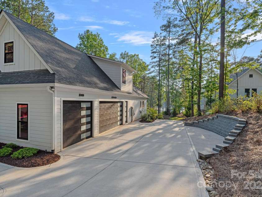 127 Holt Lane, Mooresville, NC 28117.  MLS# CAR4248273, YatesRealty ID 16978. Side Load Garage - 3 of 4 - Expanded Turn-Around