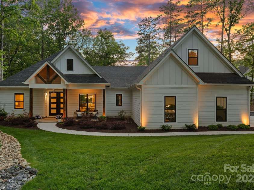 127 Holt Lane, Mooresville, NC 28117.  MLS# CAR4248273, YatesRealty ID 16978. Stunning Street Appeal, Meticulous Landscaping & Lighting