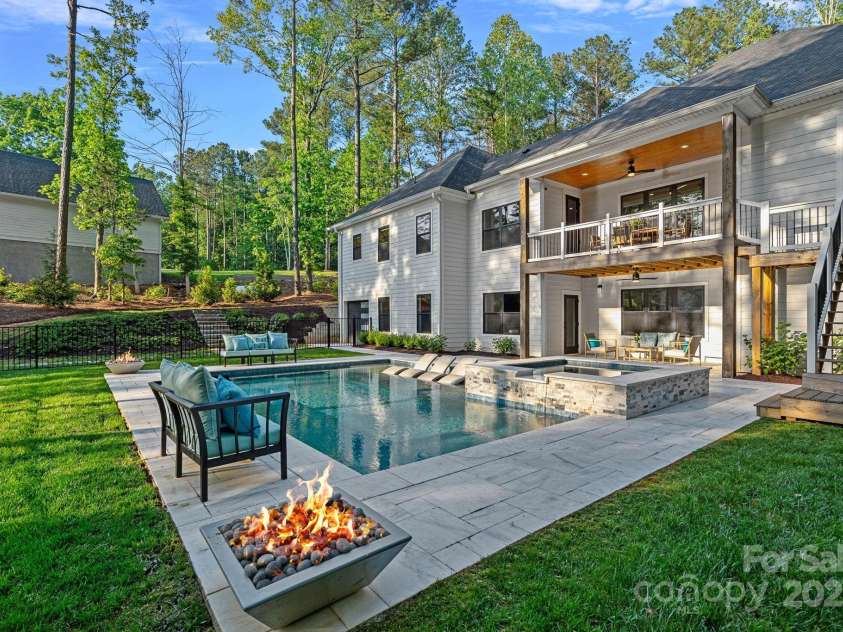 127 Holt Lane, Mooresville, NC 28117.  MLS# CAR4248273, YatesRealty ID 16978. Waterfront Resort-Style Pool, Spa, & Fire pits
