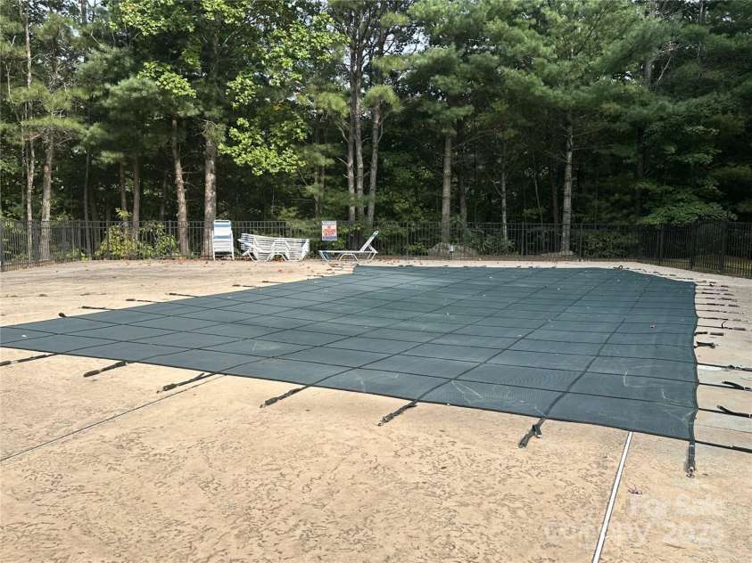 221 Toxaway Falls Drive, Lake Toxaway, NC 28747.  MLS# CAR4246910, YatesRealty ID 16979. Community heated pool