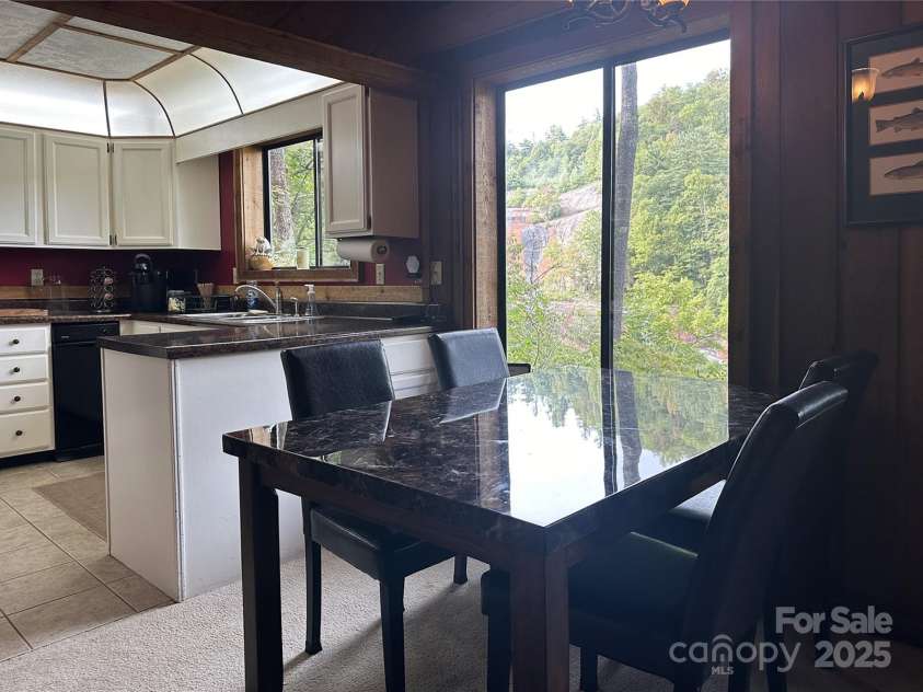 221 Toxaway Falls Drive, Lake Toxaway, NC 28747.  MLS# CAR4246910, YatesRealty ID 16979. Dining with a view!