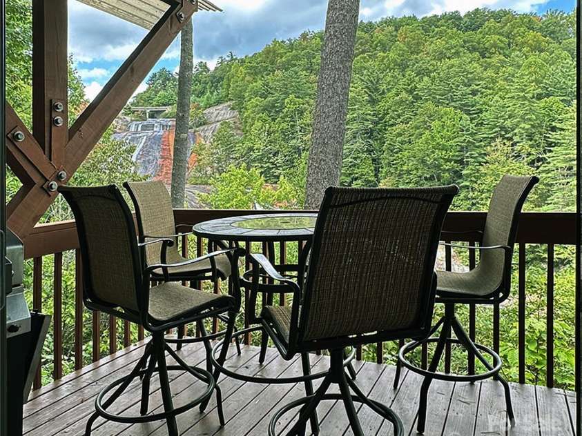 221 Toxaway Falls Drive, Lake Toxaway, NC 28747.  MLS# CAR4246910, YatesRealty ID 16979. Enjoy sights and sounds of waterfall and nature.