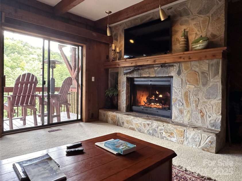 221 Toxaway Falls Drive, Lake Toxaway, NC 28747.  MLS# CAR4246910, YatesRealty ID 16979. Stone, gas log fireplace