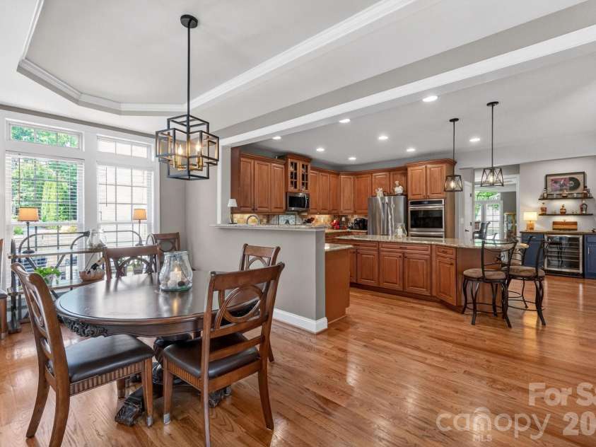 7835 Sand Trap Lane, Stanley, NC 28164.  MLS# CAR4372005, YatesRealty ID 16991. Eat-in Breakfast area looking into the Kitchen with additional bar area.