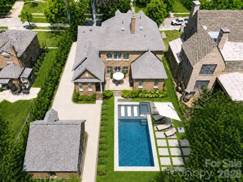 2046 Hopedale Avenue, Charlotte, NC 28207.  MLS# CAR4371805, YatesRealty ID 16992. AI rendering of pool in the backyard to show the possibility