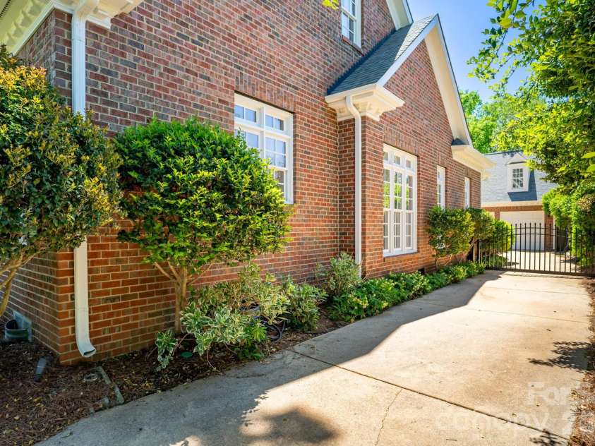 2046 Hopedale Avenue, Charlotte, NC 28207.  MLS# CAR4371805, YatesRealty ID 16992. Electric gate for extra ease and security