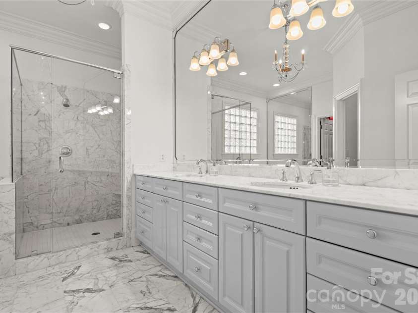 2046 Hopedale Avenue, Charlotte, NC 28207.  MLS# CAR4371805, YatesRealty ID 16992. Gorgeous primary bathroom with marble counter tops and floors