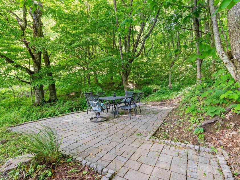 370 Fox Cove Road, Mars Hill, NC 28754.  MLS# CAR4260520, YatesRealty ID 17004. Sitting area by the stream