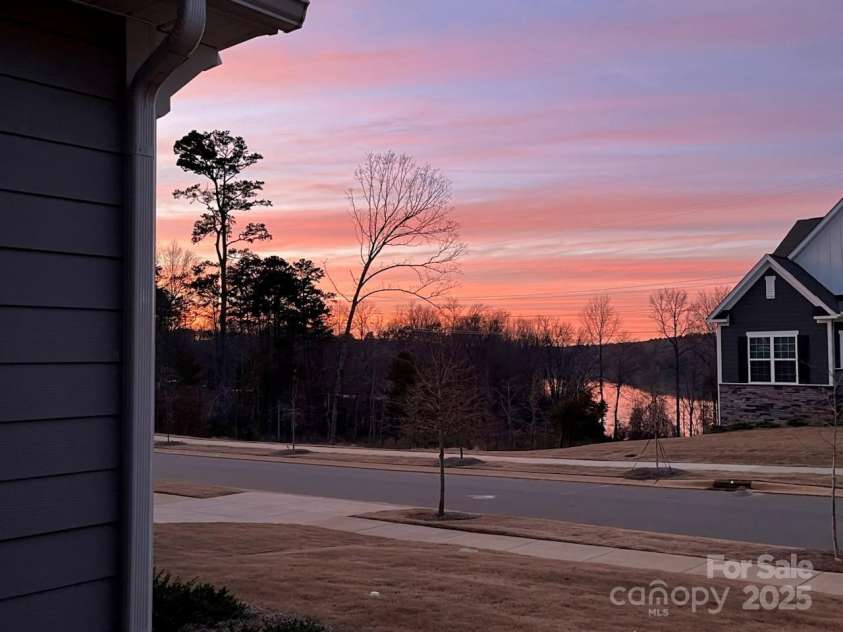 1360 Dali Boulevard, Mount Holly, NC 28120.  MLS# CAR4255366, YatesRealty ID 17006. Gorgeous sunsets over the lake!