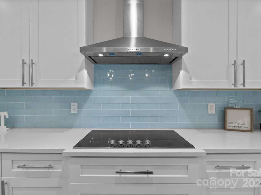 8225 Long Island Road, Catawba, NC 28609.  MLS# CAR4298824, YatesRealty ID 17010. Gorgeous glass tile backsplash and vent hood
