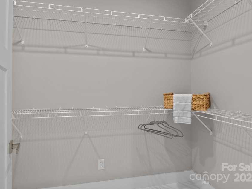 8225 Long Island Road, Catawba, NC 28609.  MLS# CAR4298824, YatesRealty ID 17010. One of two spacious walk-in closets in the primary bedroom, offering generous storage and easy organization.