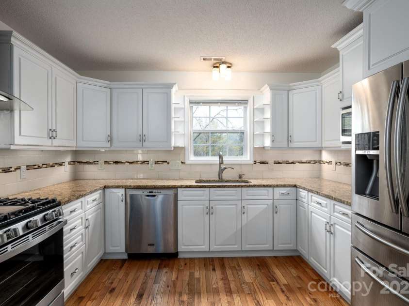 51 Sugar Hill Drive, Weaverville, NC 28787.  MLS# CAR4243411, YatesRealty ID 17014. Kitchen with Ample Storage and Pantry