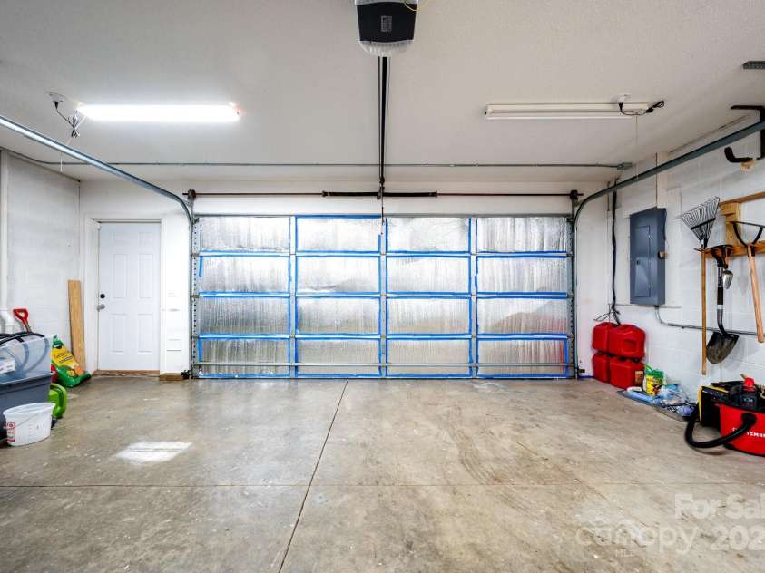 51 Sugar Hill Drive, Weaverville, NC 28787.  MLS# CAR4243411, YatesRealty ID 17014. Large Garage with Plenty of Storage