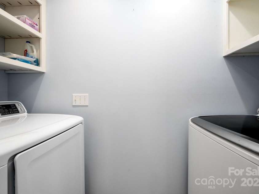 51 Sugar Hill Drive, Weaverville, NC 28787.  MLS# CAR4243411, YatesRealty ID 17014. Laundry Area off the Primary Bath includes Storage
