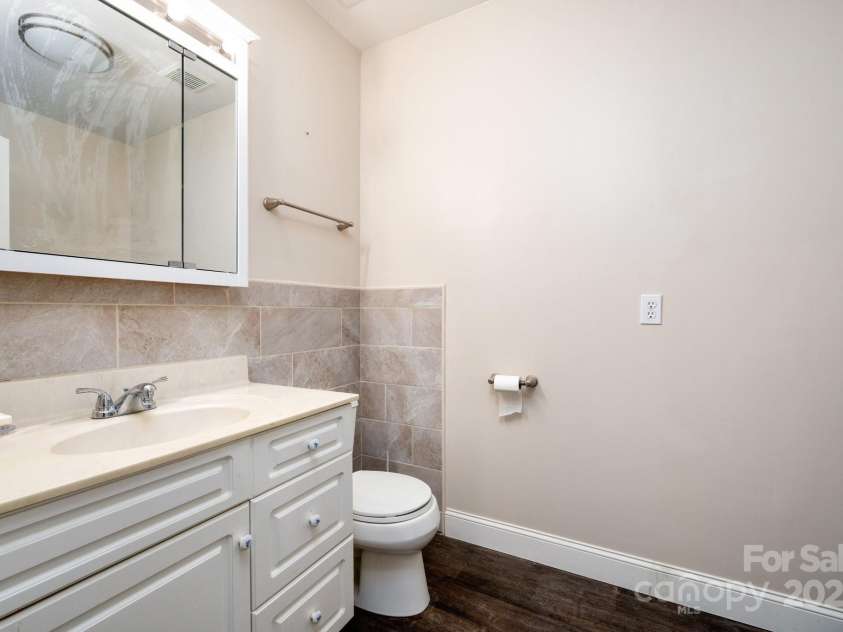 51 Sugar Hill Drive, Weaverville, NC 28787.  MLS# CAR4243411, YatesRealty ID 17014. Lower-Level Half Bath