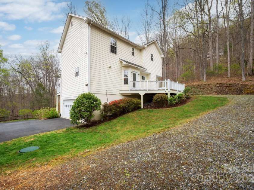 51 Sugar Hill Drive, Weaverville, NC 28787.  MLS# CAR4243411, YatesRealty ID 17014. Side View Showing Garage